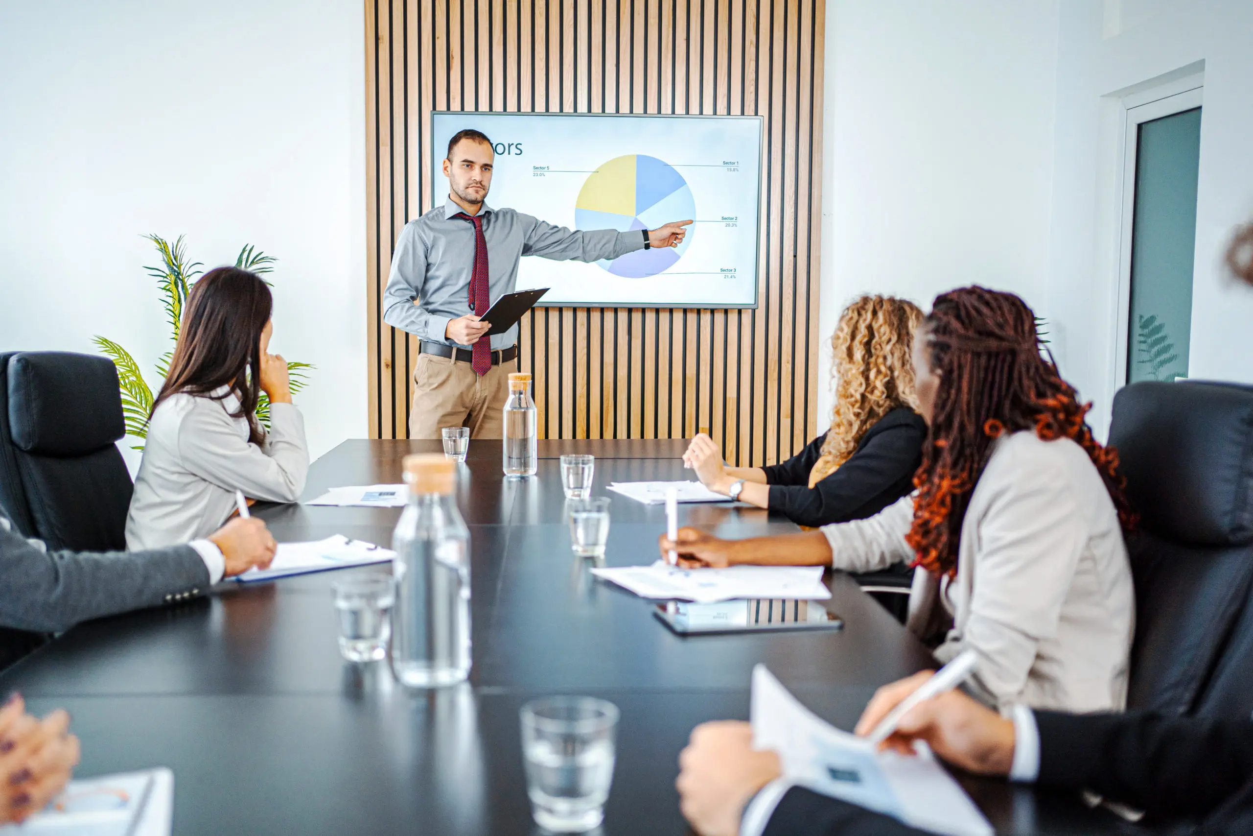 man dressed in business clothes presenting
